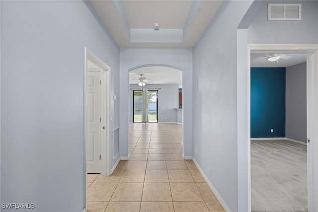 1322 SW 22nd Ave, Cape Coral, FL 33991 - hallway featuring arched walkways, visible vents, baseboards, and light tile patterned floors