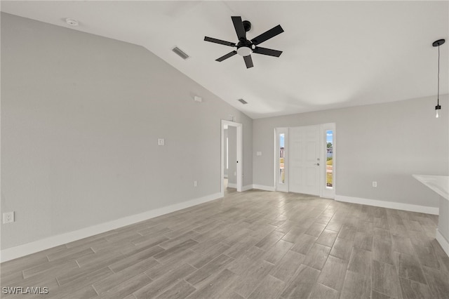 unfurnished living room with visible vents, ceiling fan, light wood-type flooring, and vaulted ceiling