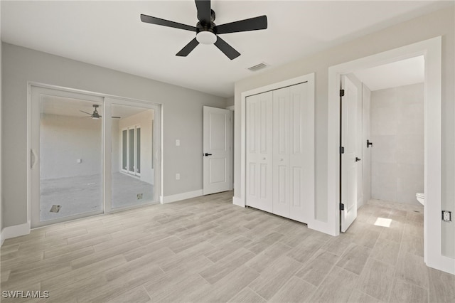 unfurnished bedroom with visible vents, light wood-type flooring, a ceiling fan, and baseboards