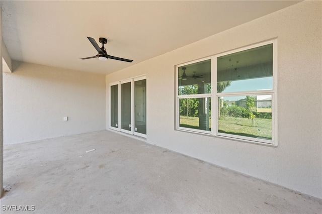 view of patio featuring ceiling fan