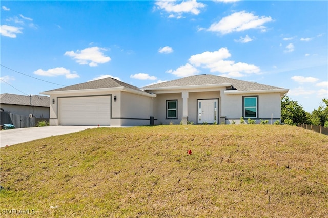 prairie-style house with concrete driveway, a garage, stucco siding, and fence