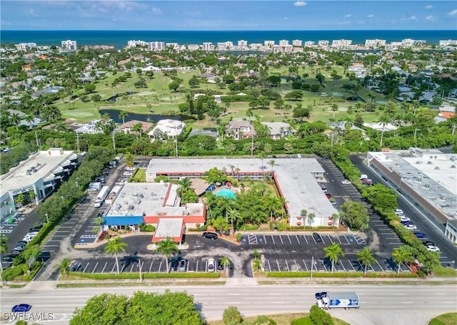 drone / aerial view featuring a water view and view of golf course