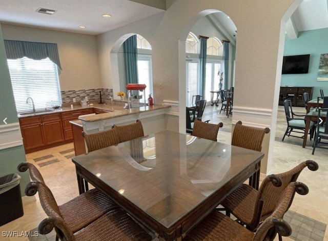 8799 Spring Mountain Way, Fort Myers, FL 33908 - dining space with visible vents, arched walkways, a wealth of natural light, and recessed lighting