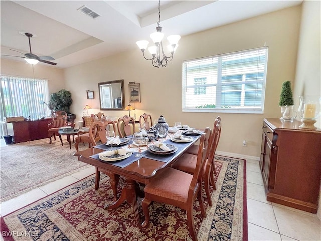 8799 Spring Mountain Way, Fort Myers, FL 33908 - dining space featuring light tile patterned flooring, visible vents, a wealth of natural light, and a raised ceiling