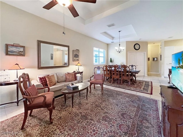 8799 Spring Mountain Way, Fort Myers, FL 33908 - living area with a raised ceiling, tile patterned floors, ceiling fan with notable chandelier, baseboards, and visible vents