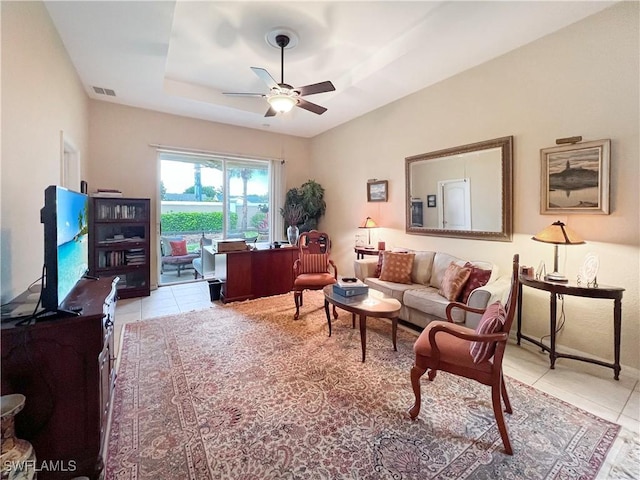8799 Spring Mountain Way, Fort Myers, FL 33908 - living area featuring ceiling fan, visible vents, light tile patterned floors, and a raised ceiling