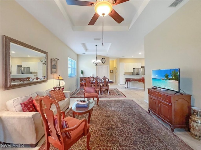 8799 Spring Mountain Way, Fort Myers, FL 33908 - living area featuring a ceiling fan, a tray ceiling, visible vents, and light tile patterned floors
