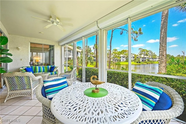 27071 Lake Harbor Ct Unit 103, Bonita Springs, FL 34134 - sunroom with ceiling fan, tile patterned flooring, a water view, and an outdoor hangout area