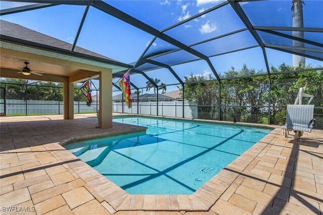 2626 SW 22nd Ave, Cape Coral, FL 33914 - view of swimming pool with a fenced in pool, a lanai, a patio, and fence