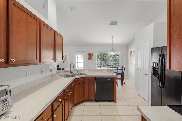 2626 SW 22nd Ave, Cape Coral, FL 33914 - kitchen with visible vents, light tile patterned floors, a sink, black appliances, and a peninsula