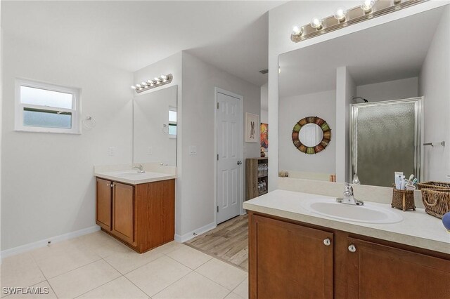 2626 SW 22nd Ave, Cape Coral, FL 33914 - full bath with a shower stall, tile patterned flooring, baseboards, and a sink
