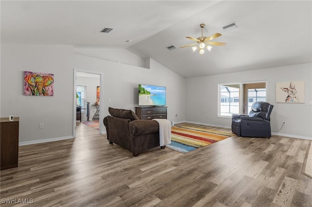 2626 SW 22nd Ave, Cape Coral, FL 33914 - living area featuring vaulted ceiling, visible vents, wood finished floors, baseboards, and ceiling fan
