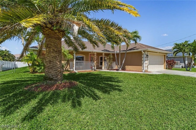 2626 SW 22nd Ave, Cape Coral, FL 33914 - view of front facade with concrete driveway, fence, a porch, a garage, and stucco siding