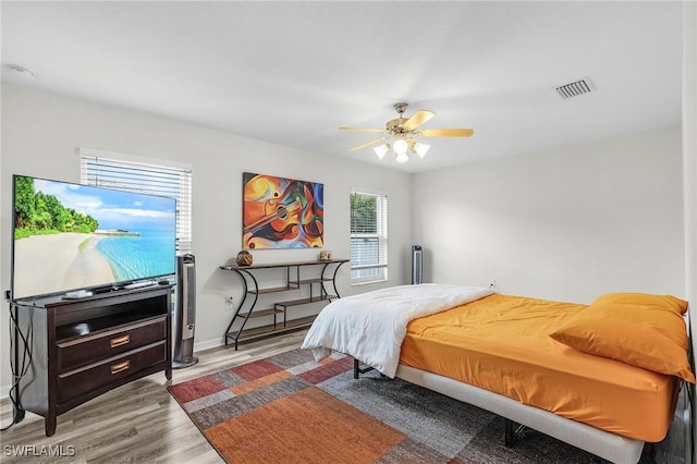 2626 SW 22nd Ave, Cape Coral, FL 33914 - bedroom with ceiling fan, baseboards, wood finished floors, and visible vents