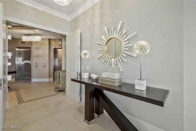 hall with elevator, a chandelier, baseboards, and crown molding