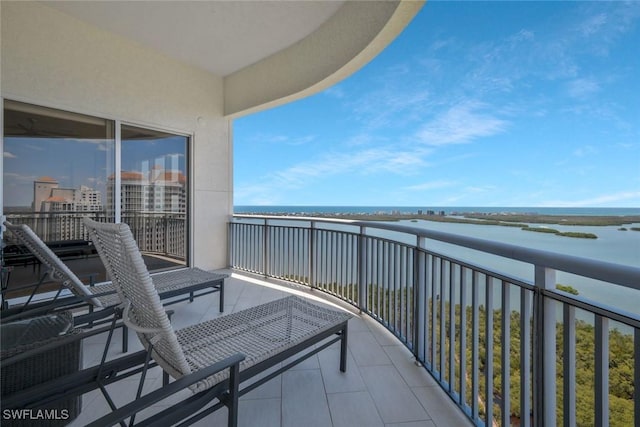 balcony featuring a water view
