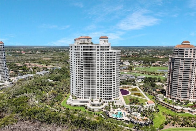 bird's eye view of a pool area and a large body of water