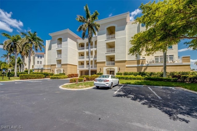 view of property with uncovered parking