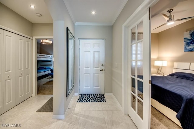 tiled entryway with recessed lighting, baseboards, ornamental molding, and french doors