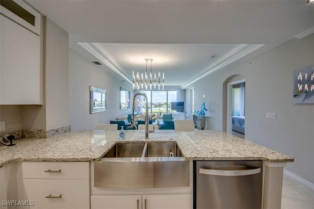 kitchen with stainless steel dishwasher, a sink, white cabinetry, light stone countertops, and visible vents