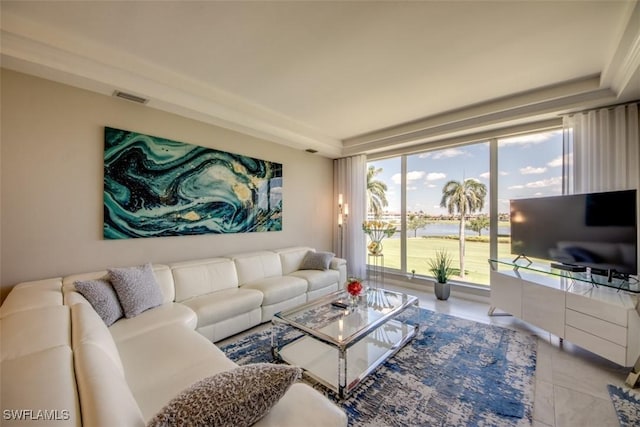 tiled living room featuring visible vents