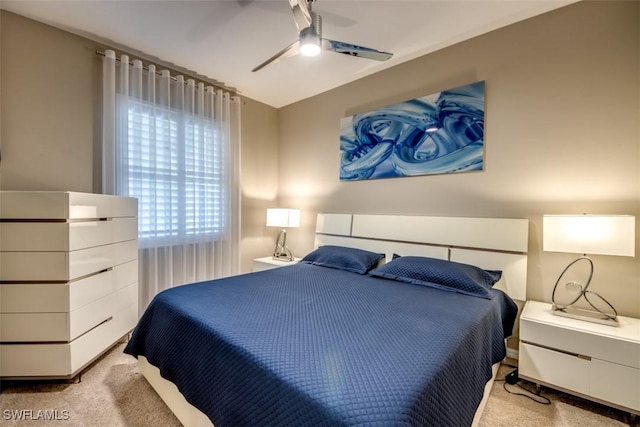 bedroom featuring ceiling fan and light colored carpet