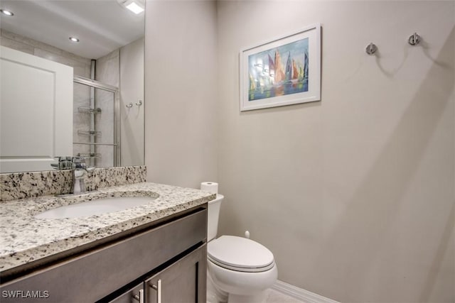 full bathroom with toilet, vanity, recessed lighting, and a stall shower