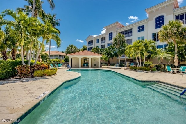 community pool with a patio area