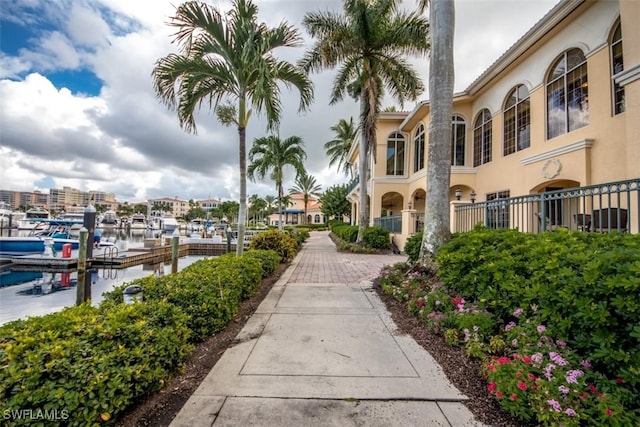 surrounding community featuring a water view