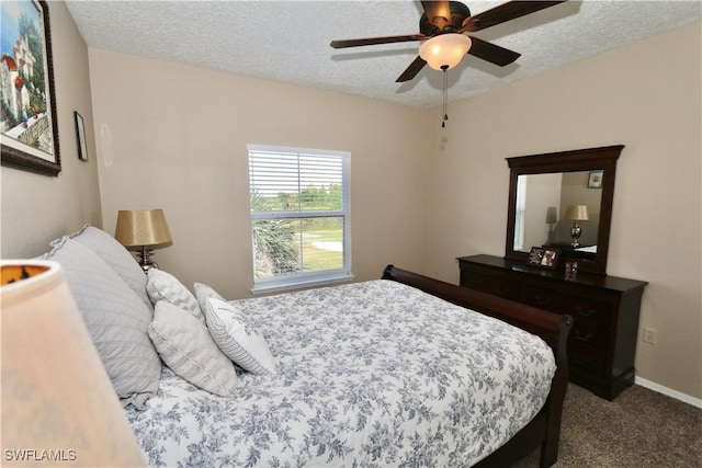 bedroom featuring carpet floors, a textured ceiling, and ceiling fan