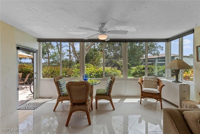 sunroom featuring a textured ceiling