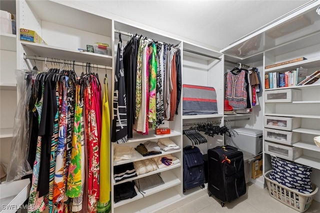 spacious closet featuring tile patterned floors