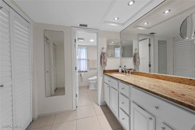 full bathroom with toilet, tile patterned flooring, visible vents, and a closet