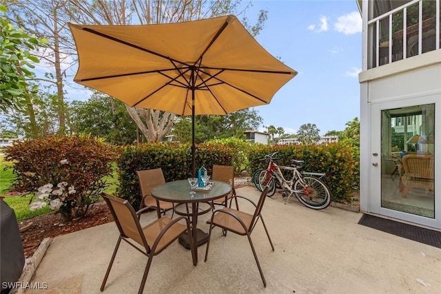 view of patio featuring outdoor dining area