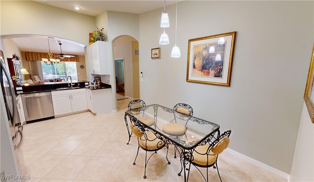 327 Monaco Dr Unit 12, Punta Gorda, FL 33950 - dining room featuring baseboards, visible vents, arched walkways, and light tile patterned flooring