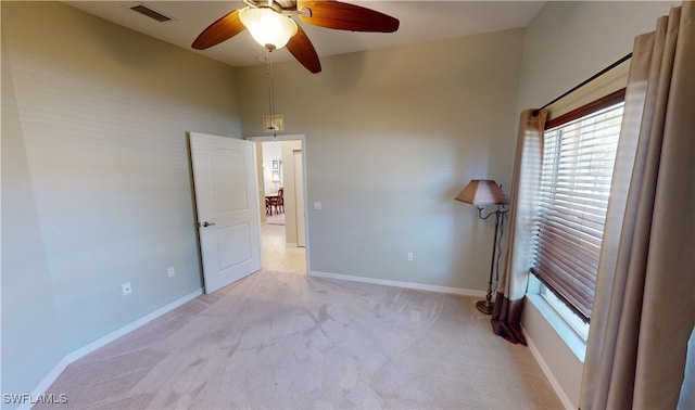 327 Monaco Dr Unit 12, Punta Gorda, FL 33950 - spare room featuring light carpet, a ceiling fan, visible vents, and a wealth of natural light