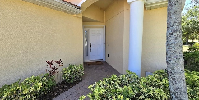 327 Monaco Dr Unit 12, Punta Gorda, FL 33950 - property entrance with a tile roof and stucco siding