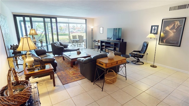 3260 Southshore Dr Unit 65A, Punta Gorda, FL 33955 - tiled living room with visible vents and baseboards