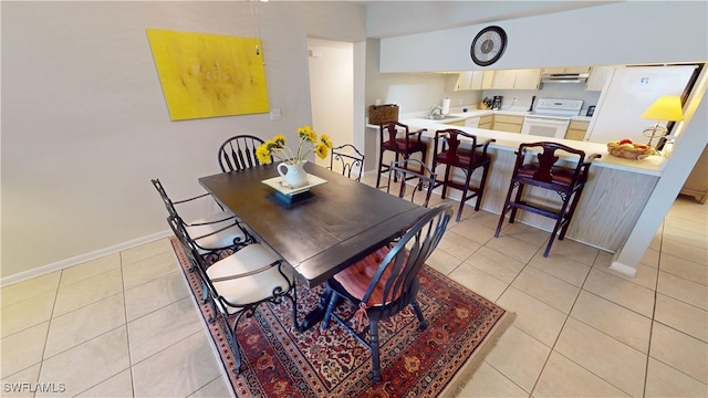 3260 Southshore Dr Unit 65A, Punta Gorda, FL 33955 - dining room with light tile patterned flooring and baseboards