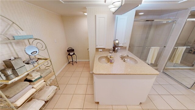 3260 Southshore Dr Unit 65A, Punta Gorda, FL 33955 - bathroom with tile patterned flooring, vanity, ornamental molding, baseboards, and a stall shower