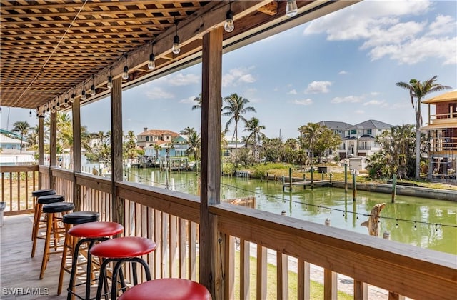 exterior space featuring a residential view and a water view