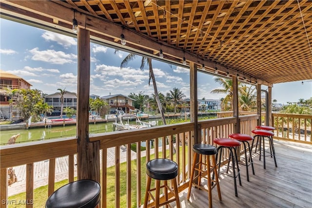 wooden deck with a water view