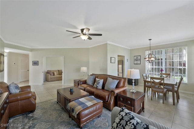 93 Silver Oaks Cir Unit 3-101, Naples, FL 34119 - living area featuring light tile patterned flooring, baseboards, ornamental molding, and ceiling fan with notable chandelier
