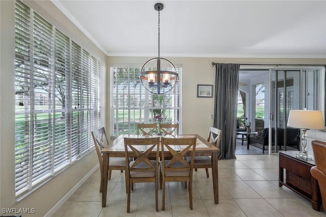 93 Silver Oaks Cir Unit 3-101, Naples, FL 34119 - dining space with a chandelier, baseboards, ornamental molding, and light tile patterned flooring