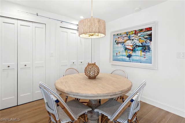2100 Gulf Shore Blvd N Unit 108, Naples, FL 34102 - dining space with light wood-style floors, baseboards, and recessed lighting