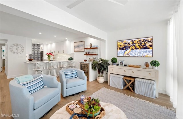 2100 Gulf Shore Blvd N Unit 108, Naples, FL 34102 - living room featuring beverage cooler, light wood-style floors, recessed lighting, and baseboards