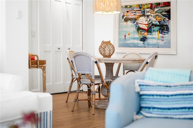 2100 Gulf Shore Blvd N Unit 108, Naples, FL 34102 - dining space featuring wood finished floors