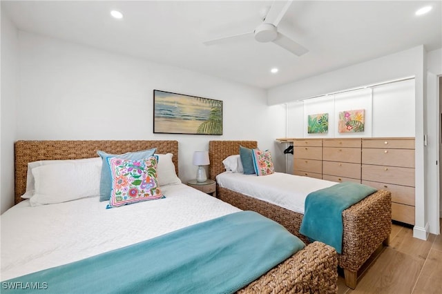 2100 Gulf Shore Blvd N Unit 108, Naples, FL 34102 - bedroom with light wood-type flooring, recessed lighting, and a ceiling fan