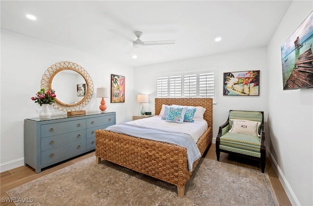 2100 Gulf Shore Blvd N Unit 108, Naples, FL 34102 - bedroom featuring wood finished floors, recessed lighting, baseboards, and ceiling fan
