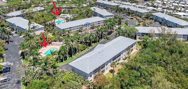 3051 Sandpiper Bay Cir Unit I102, Naples, FL 34112 - drone / aerial view of a pool area